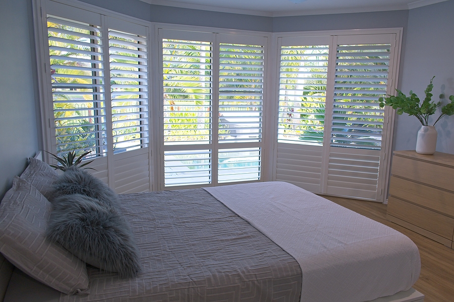 Luxury white indoor plantation shutters In a Geelong bedroom